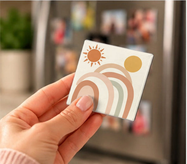 Boho Sun Art Magnets held in a hand