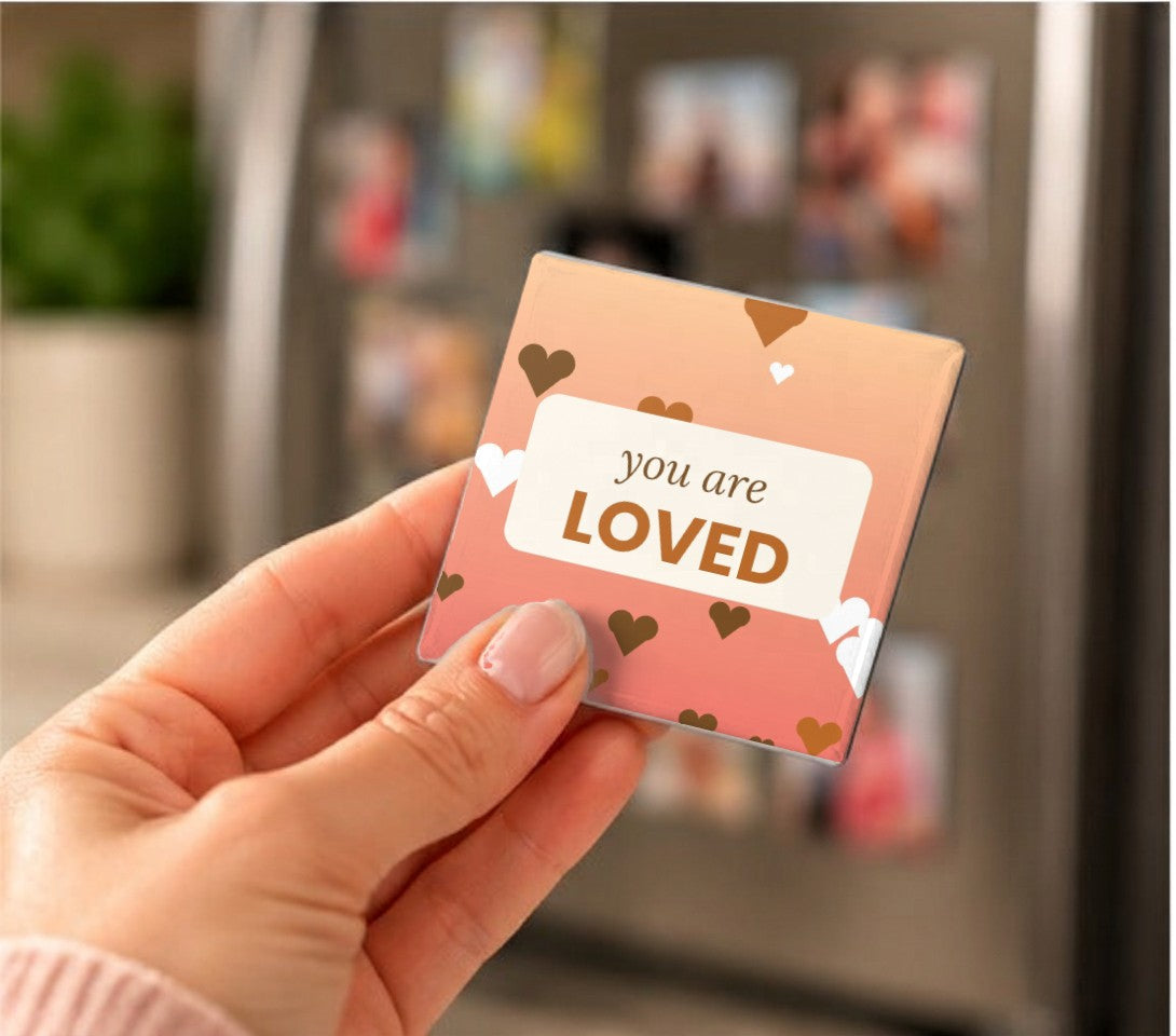 Kind Words Art Magnets held in a hand